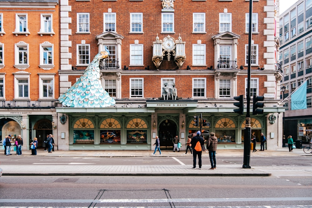 a group of people standing outside of a building