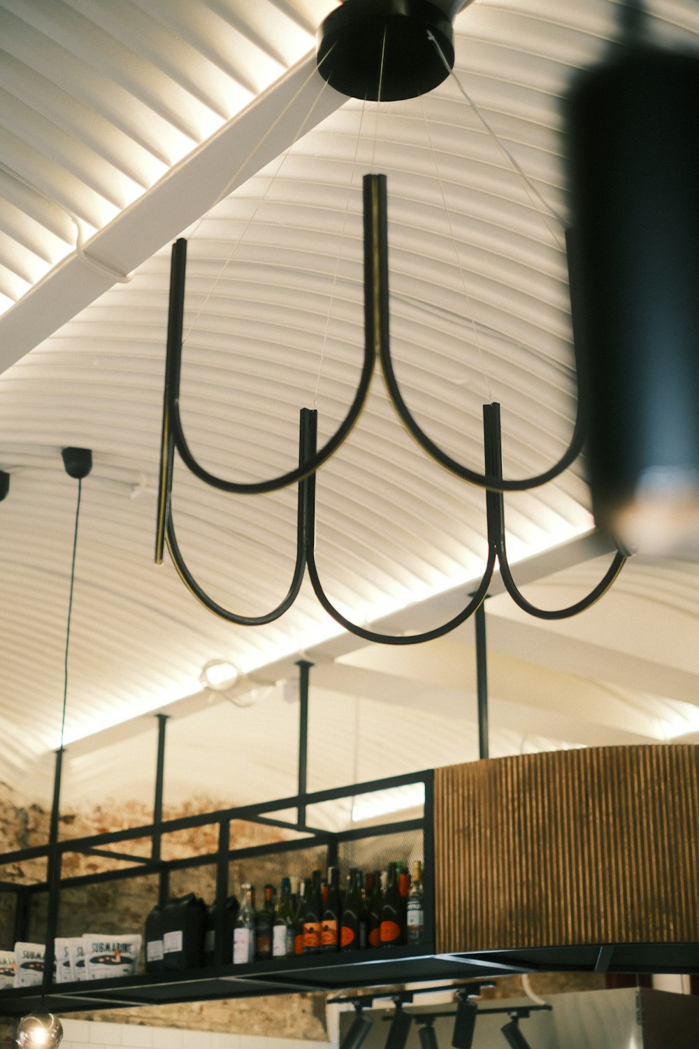 a chandelier hanging from the ceiling of a restaurant