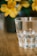 A vibrant tumbler adorned with a colorful wrap, set against a bright, cheerful background.