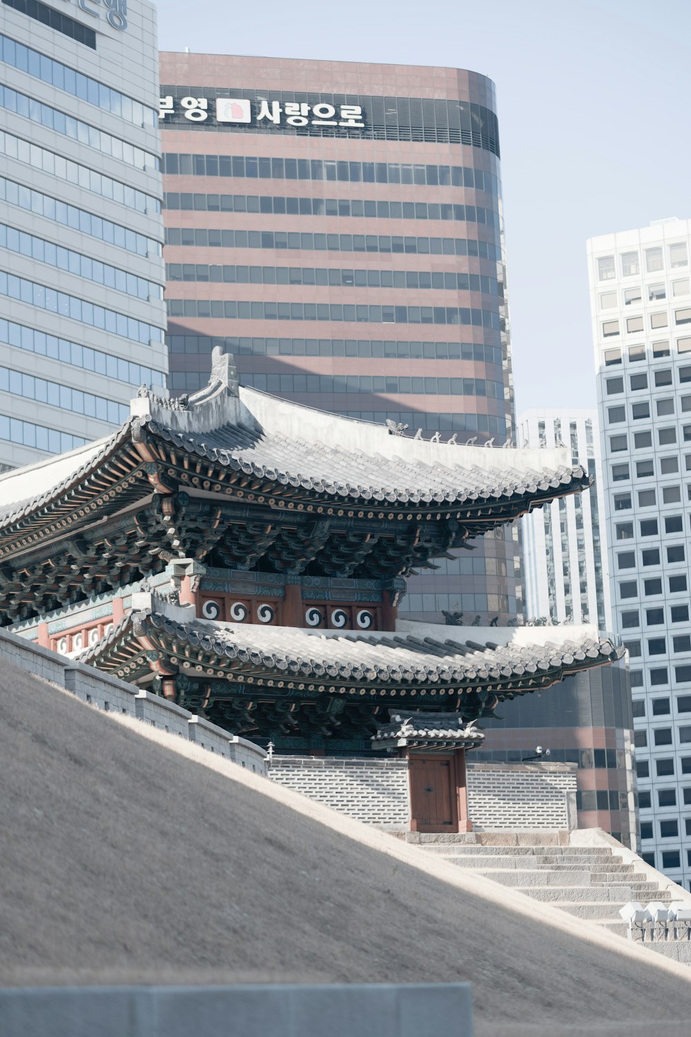 a tall building sitting next to a tall building