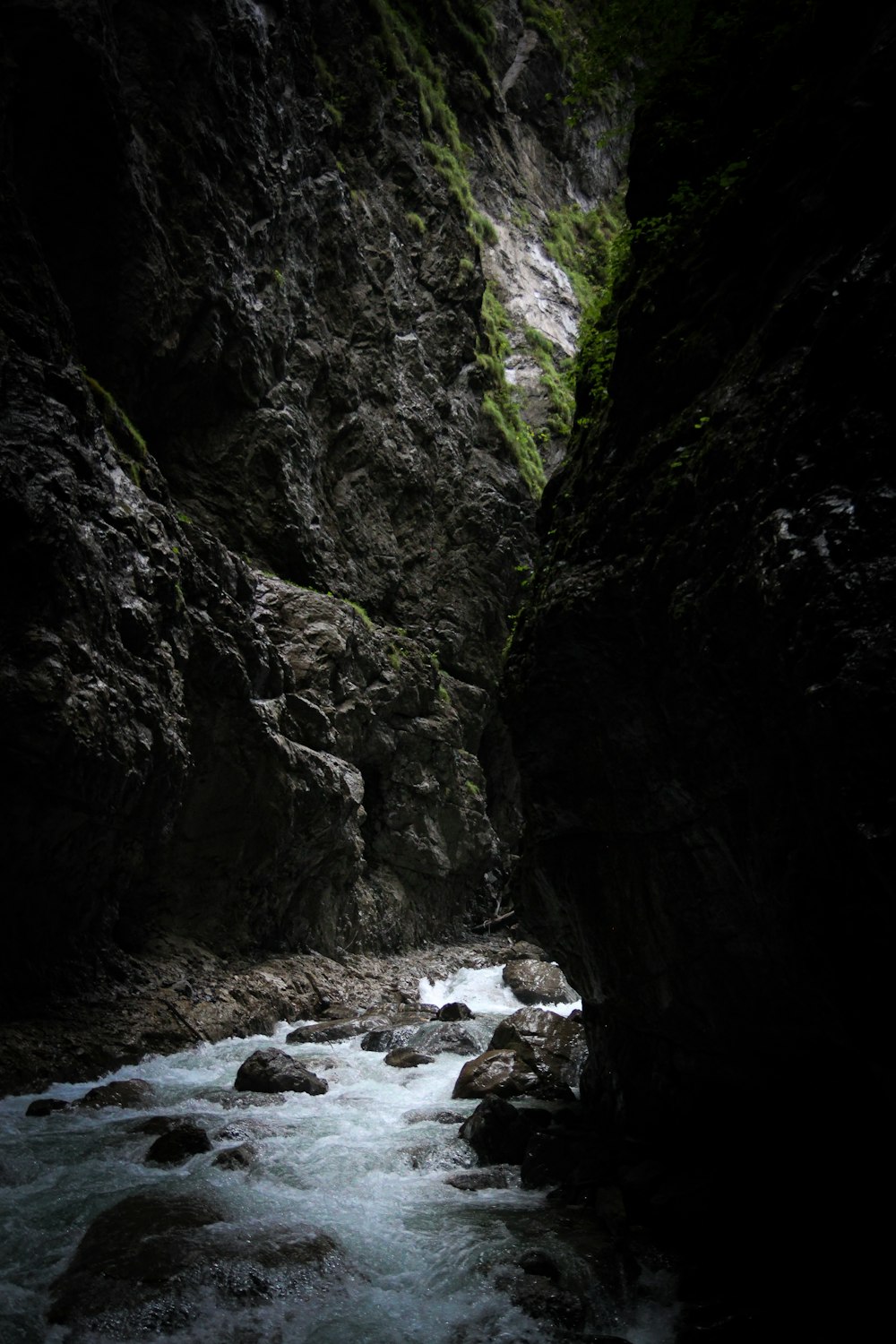 a river running through a narrow rocky canyon