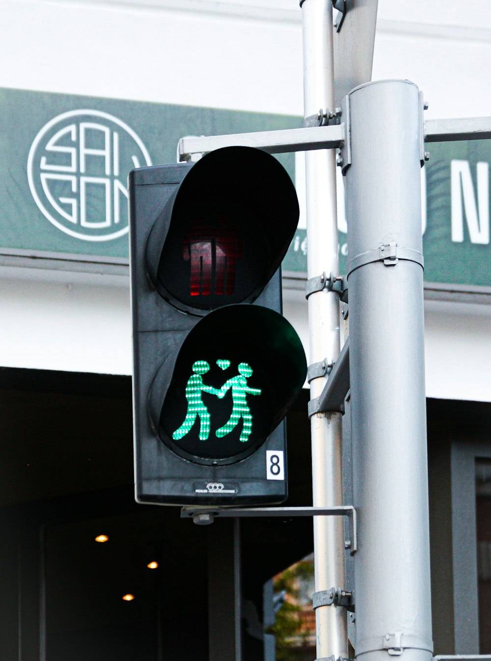 a traffic light with a green pedestrian crossing signal