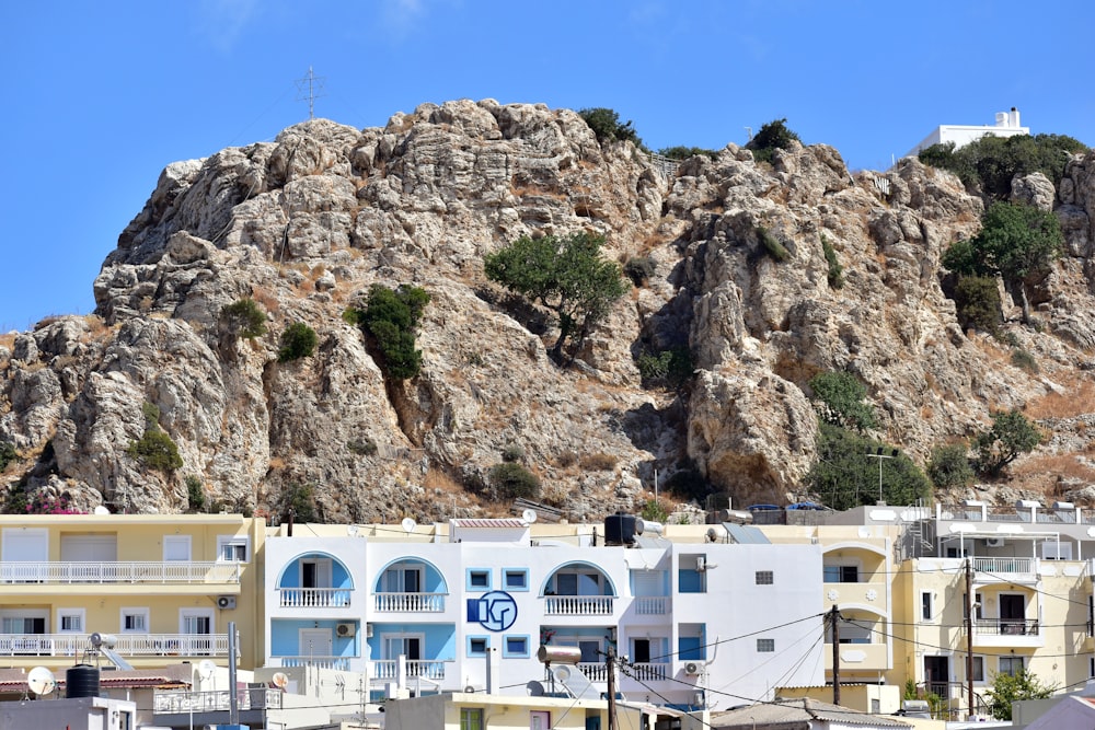 a view of some buildings and a mountain in the background