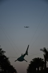 Aleta del Tiburón sculpture with tourists enjoying the sunny day.