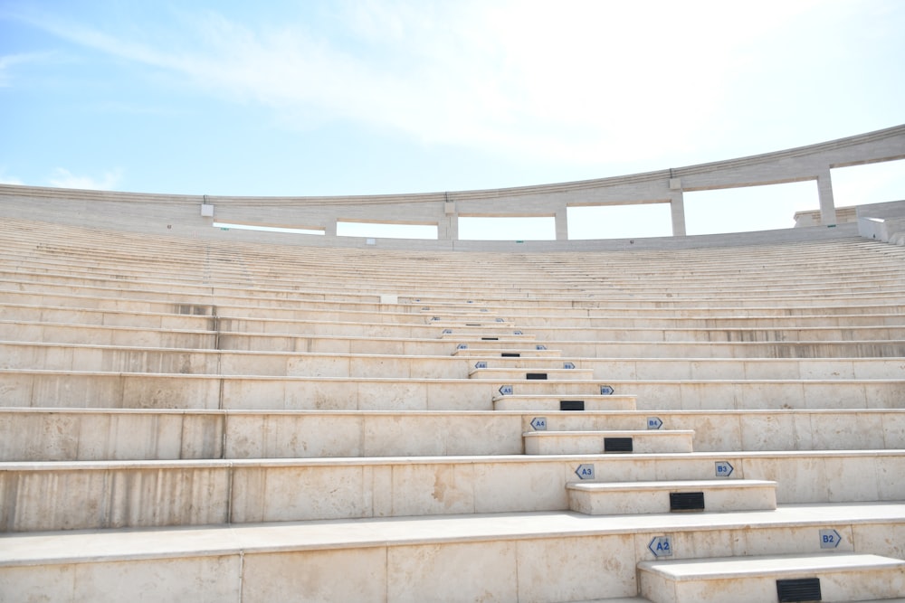 a row of stone steps leading up to an auditorium