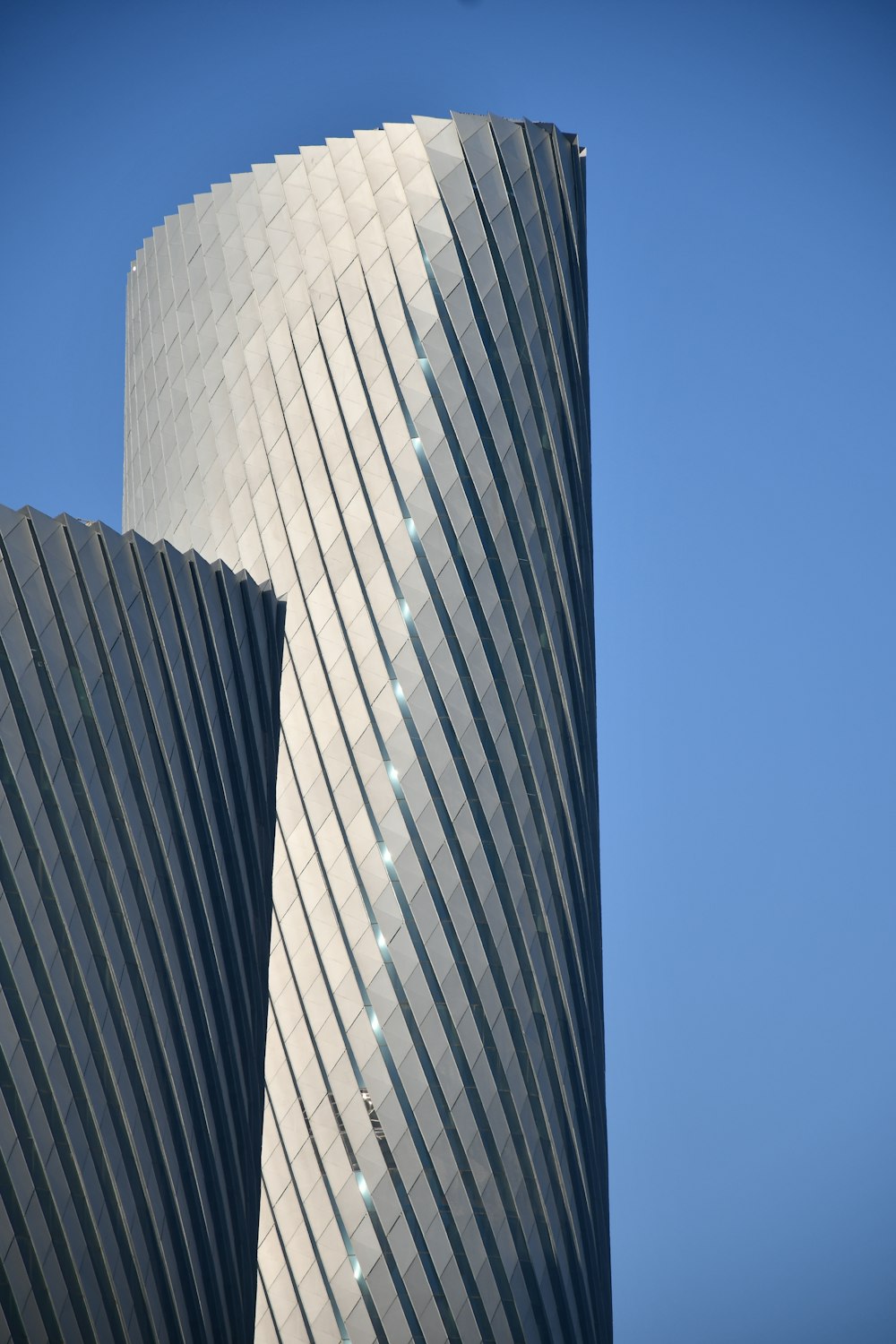 a tall building with a sky background