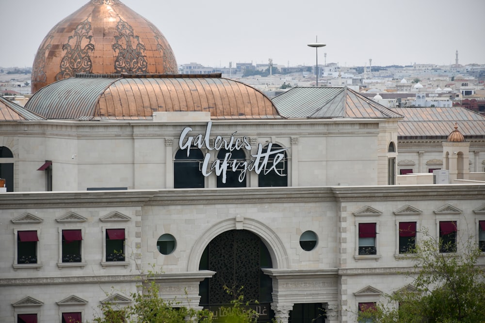 a large building with a gold dome on top of it