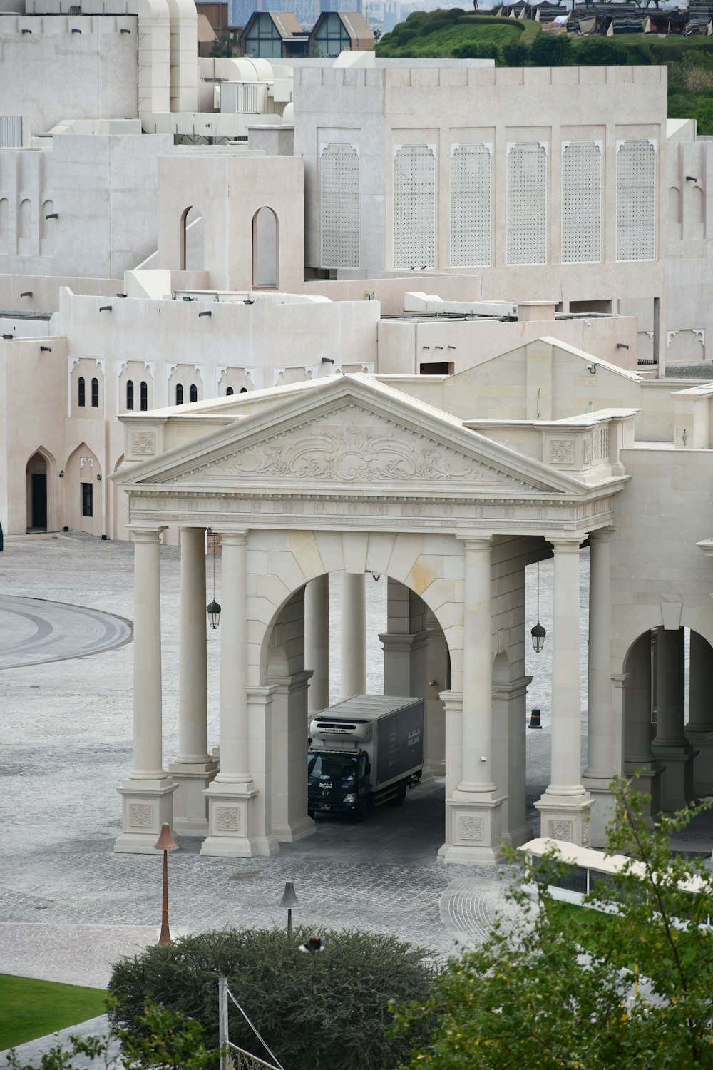 a bus parked in front of a white building