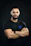 A close-up of a man confidently wearing a sleek black Tekvora shirt against a dark background.