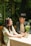 A smiling couple discussing real estate options at a cozy table.