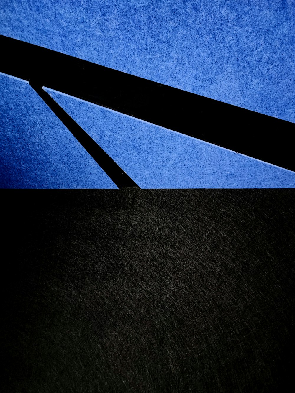 a close up of a black and blue background