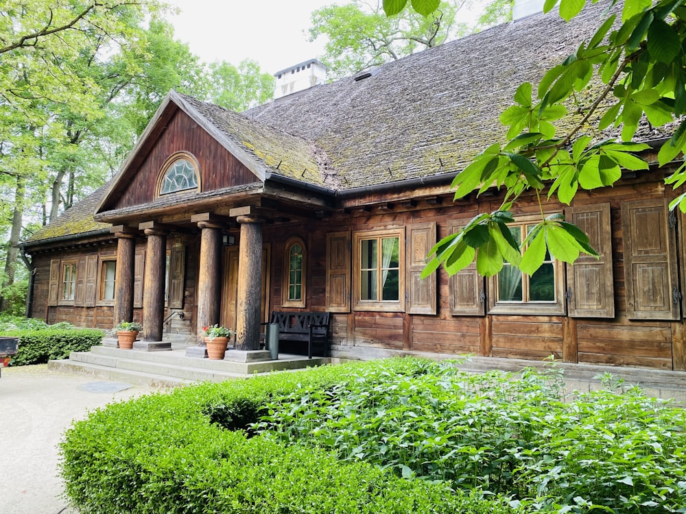 a wooden house with a large front porch