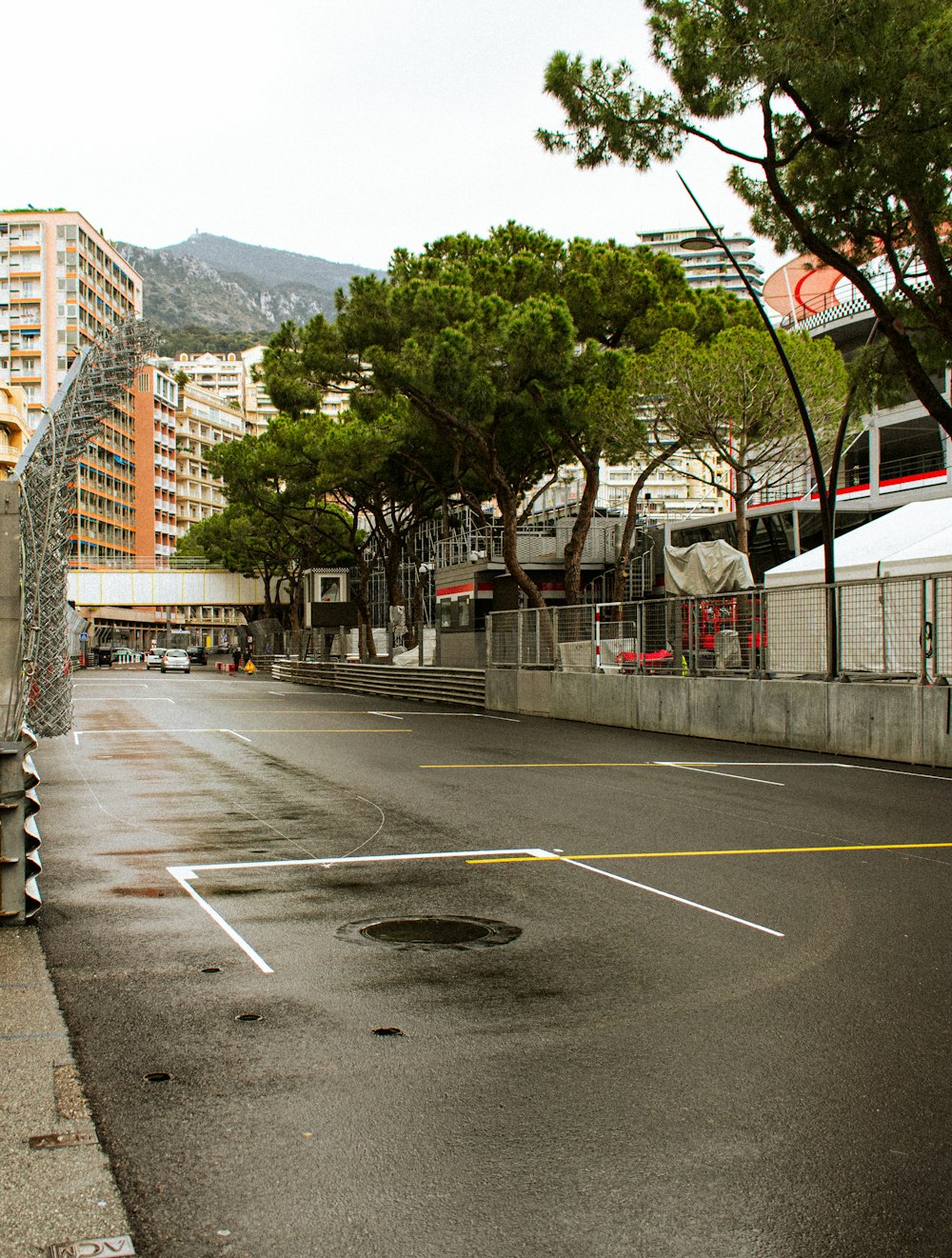 an empty street with a bus parked on the side of it