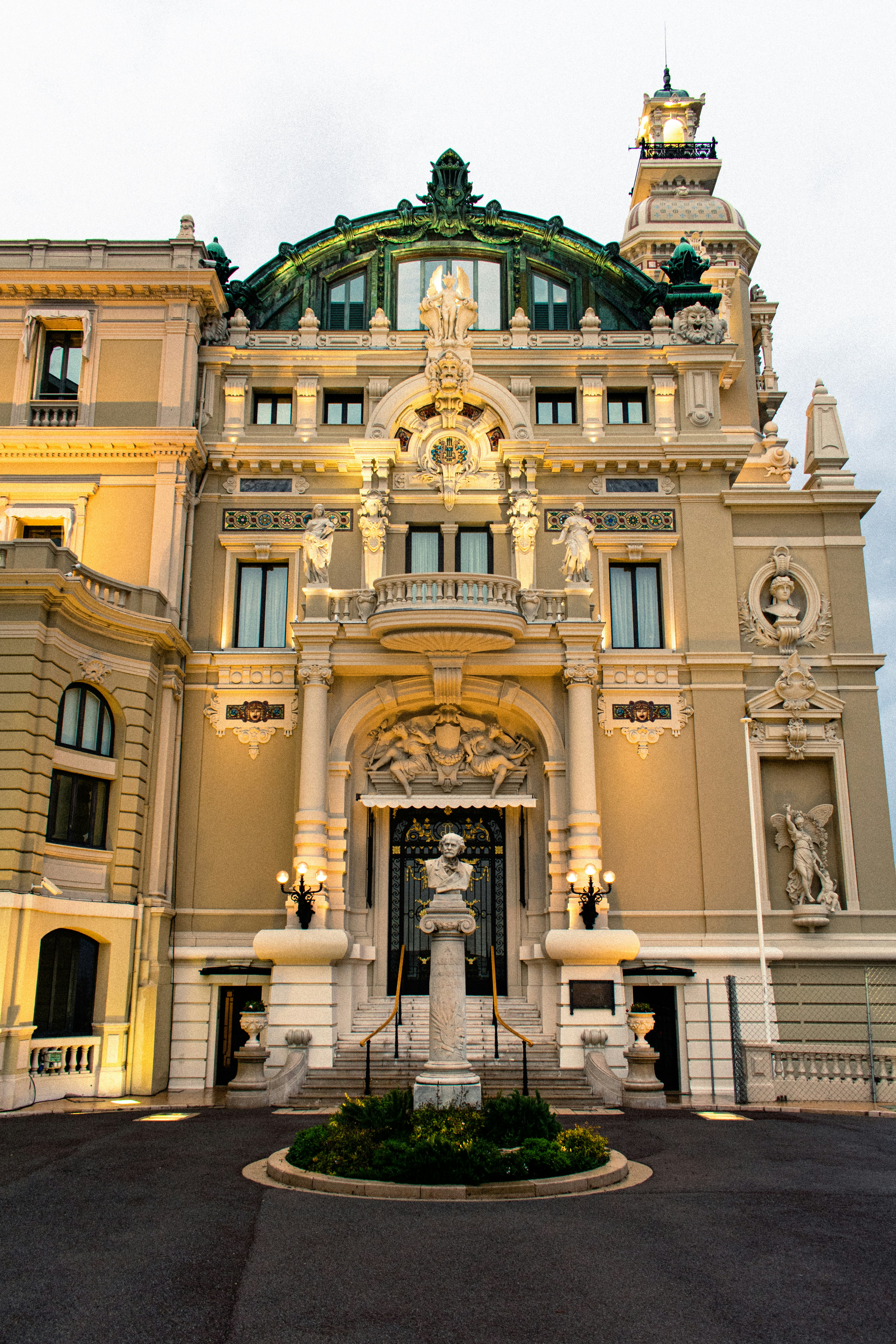 a large building with a fountain in front of it