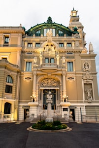 a large building with a fountain in front of it