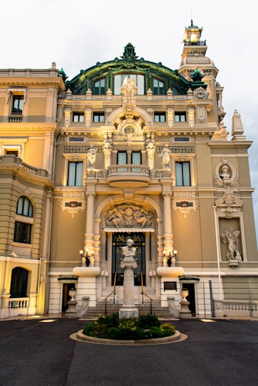 a large building with a fountain in front of it