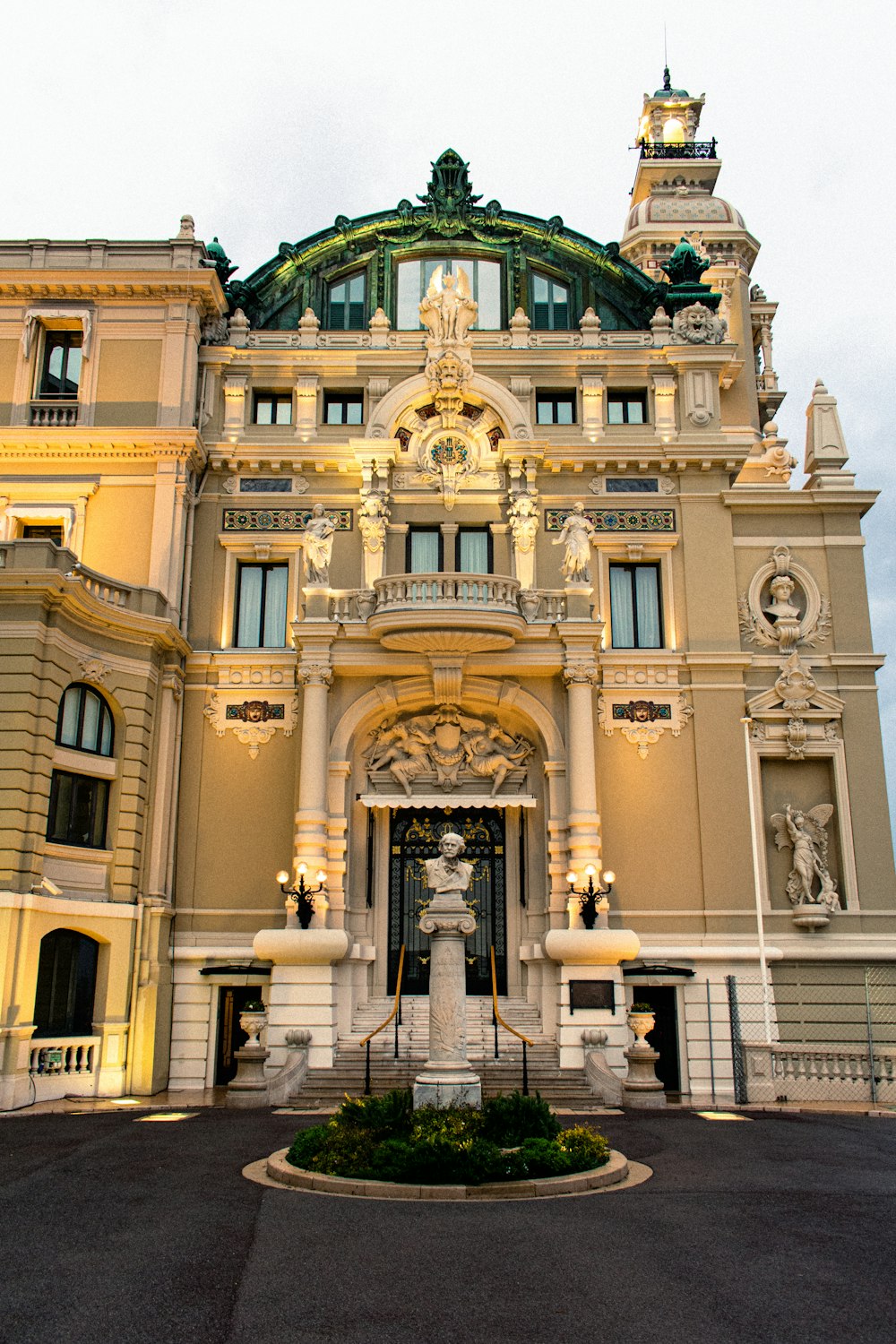 a large building with a fountain in front of it