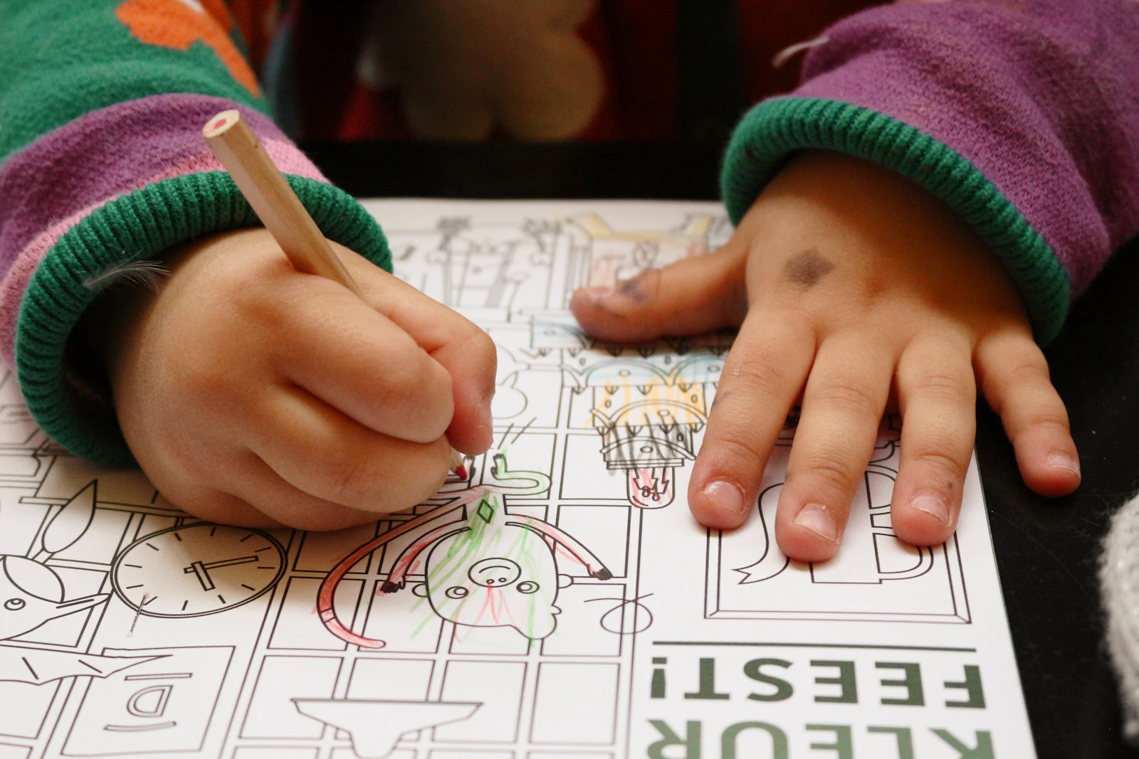 Child practicing handwriting at a table