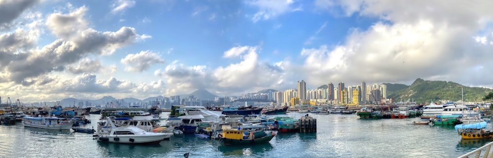 a harbor filled with lots of boats under a cloudy sky