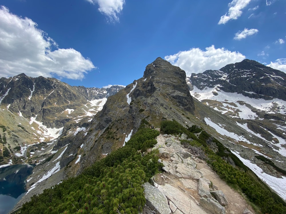 a view of a mountain range with a lake below