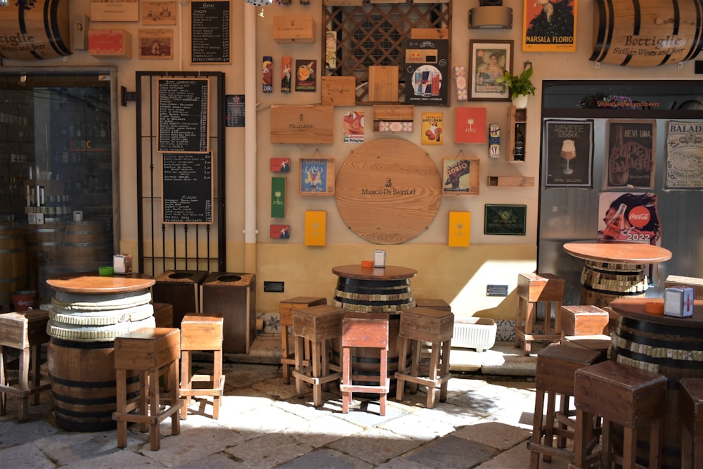 a room filled with lots of wooden tables and chairs