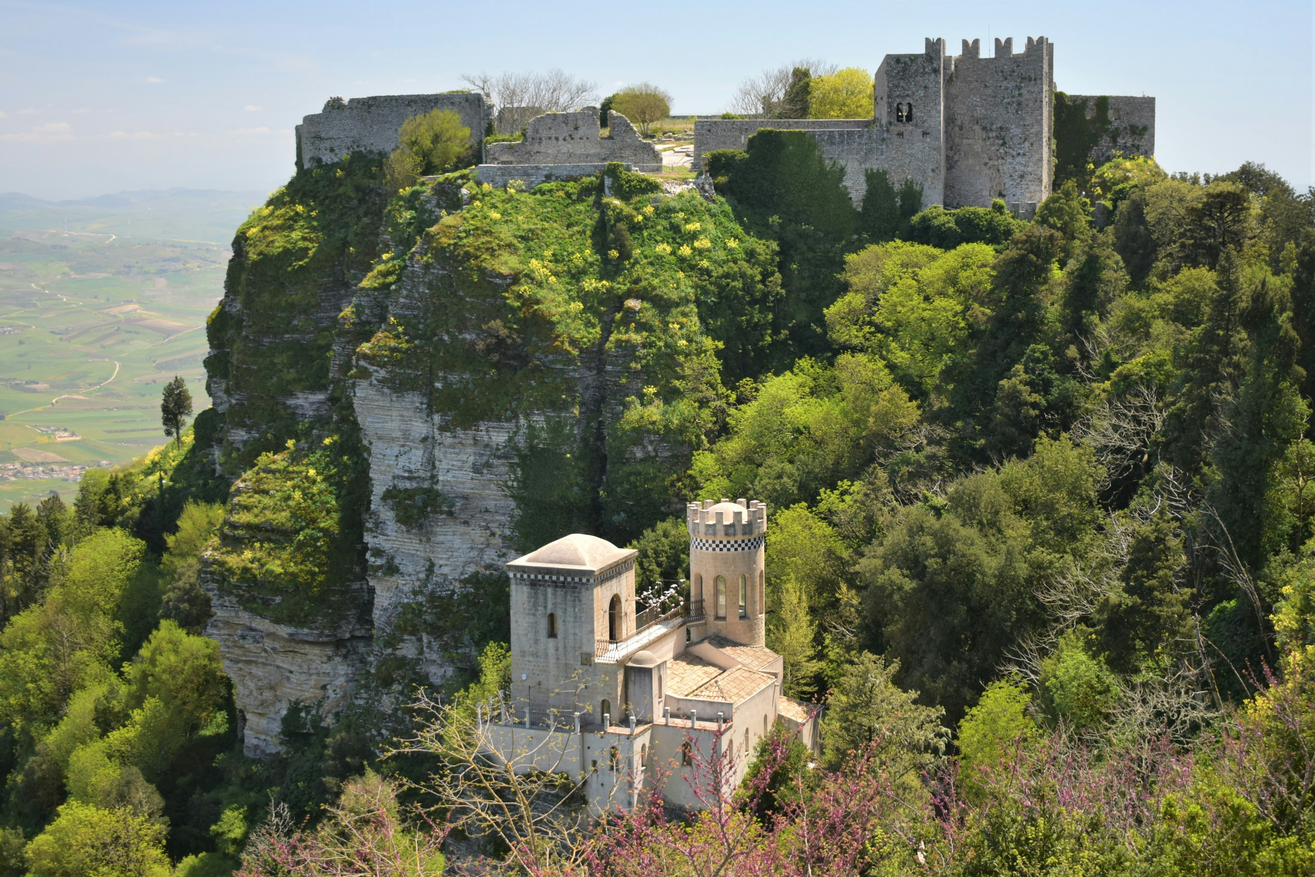 a castle perched on top of a lush green hillside, Castello di Venere / Castle of Balio, Torretta Pepoli