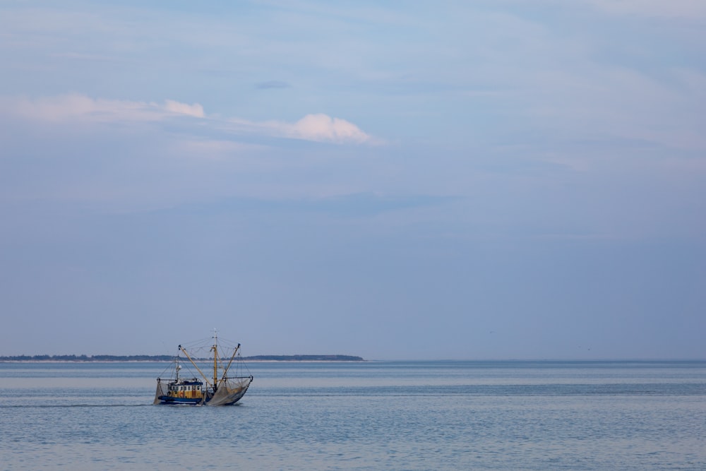 a fishing boat in the middle of the ocean