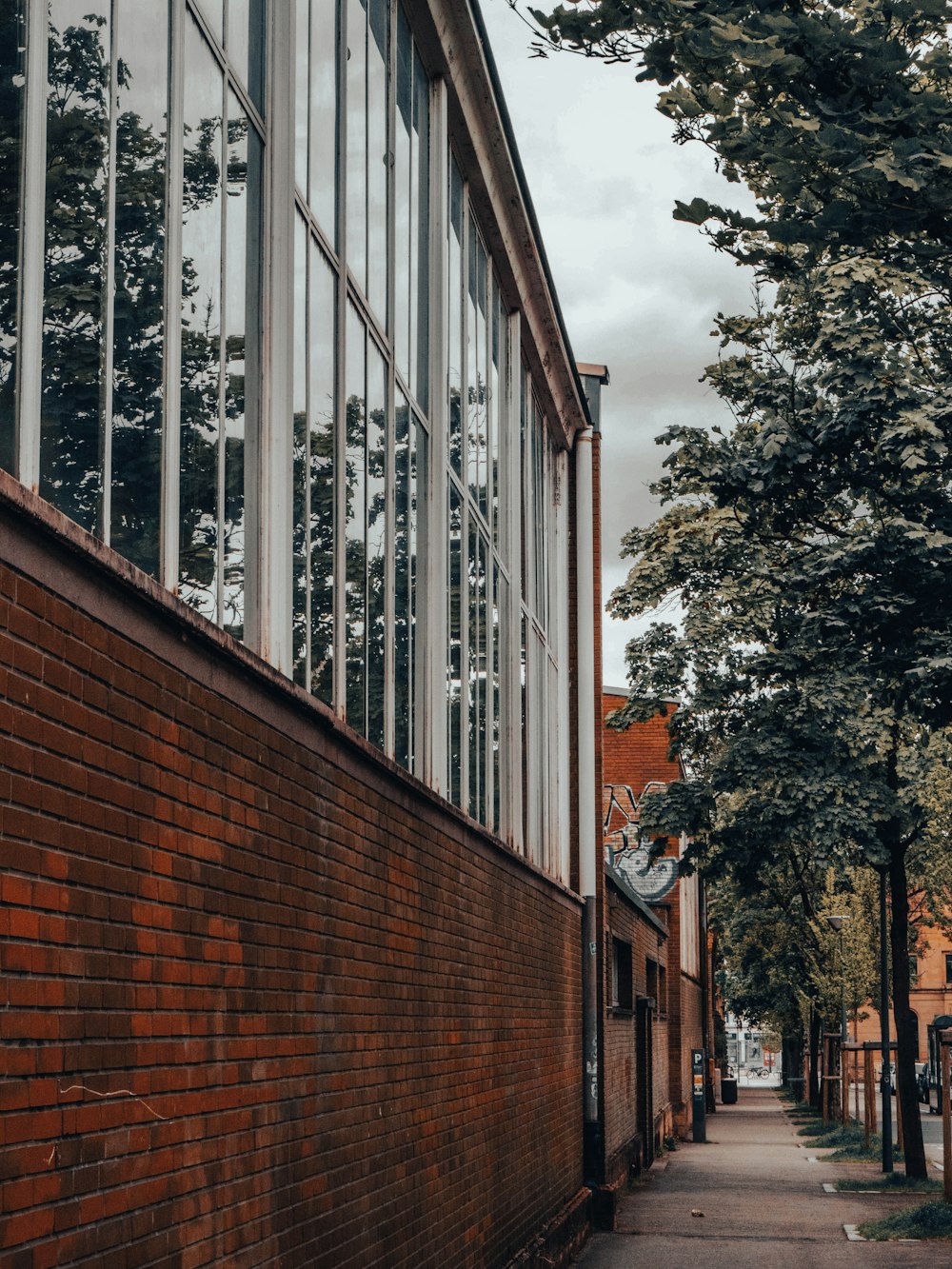 a brick building with a clock on the side of it