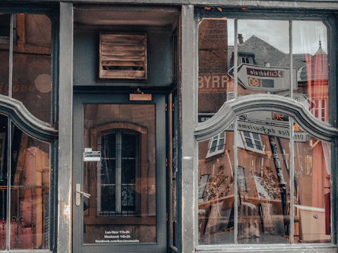 Exterior view of a building with freshly cleaned windows and entrance.