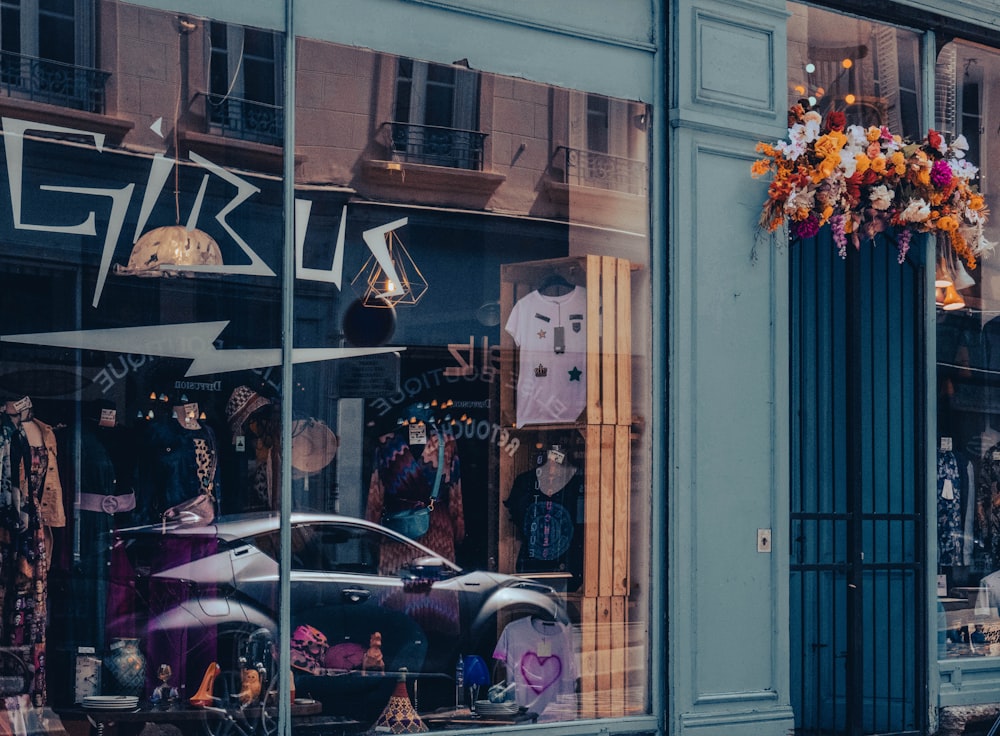 a store front with a car in the window