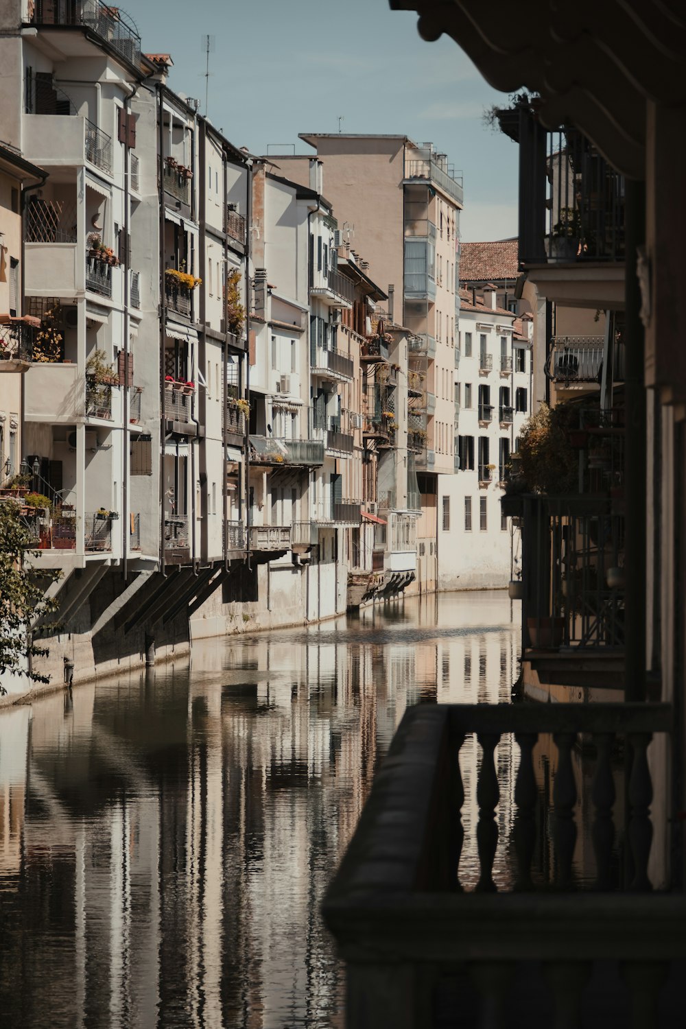 a river running through a city next to tall buildings