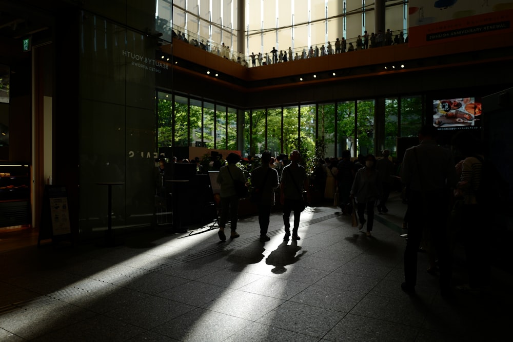 a group of people standing in a lobby