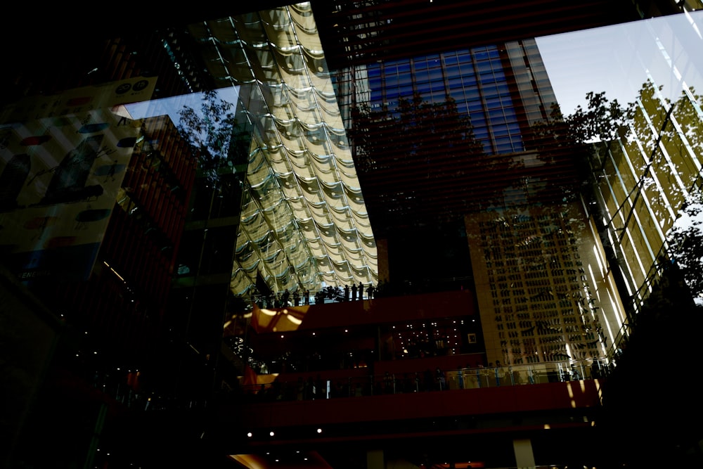 a reflection of buildings in a glass window