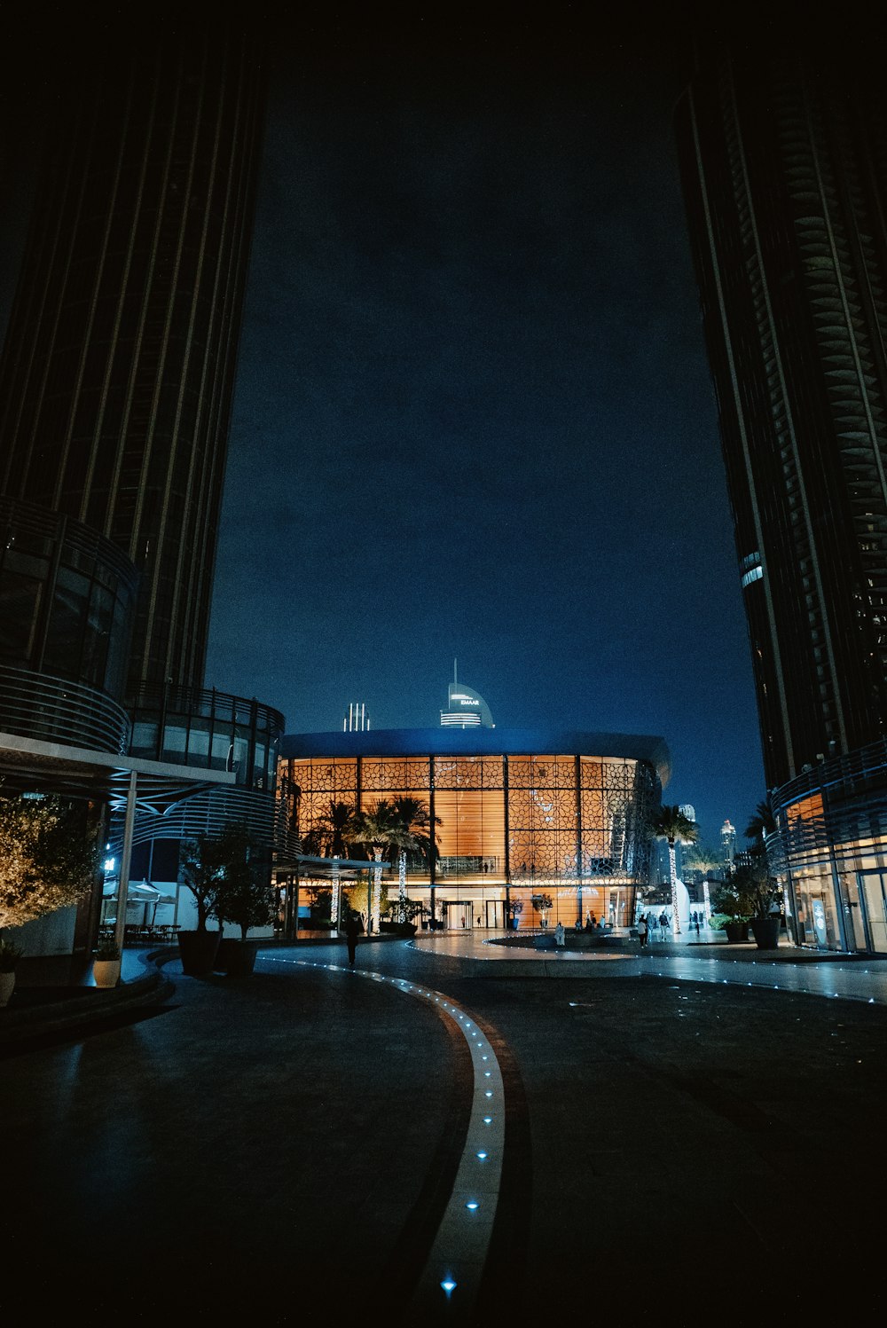 a building lit up at night in a city