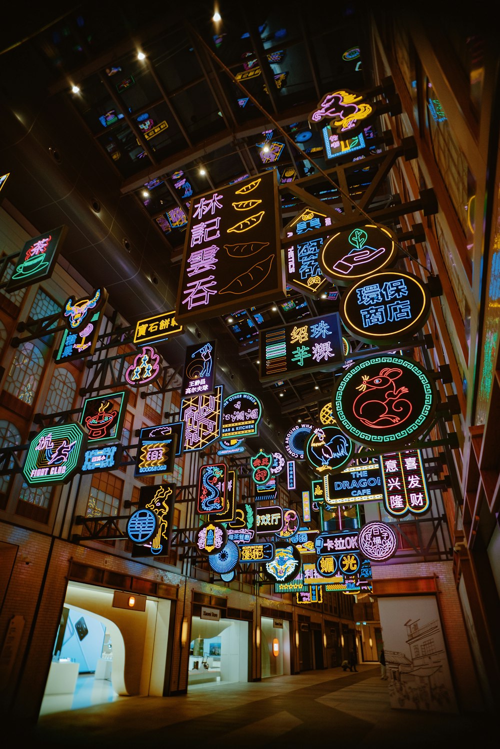 a large display of neon signs in a building