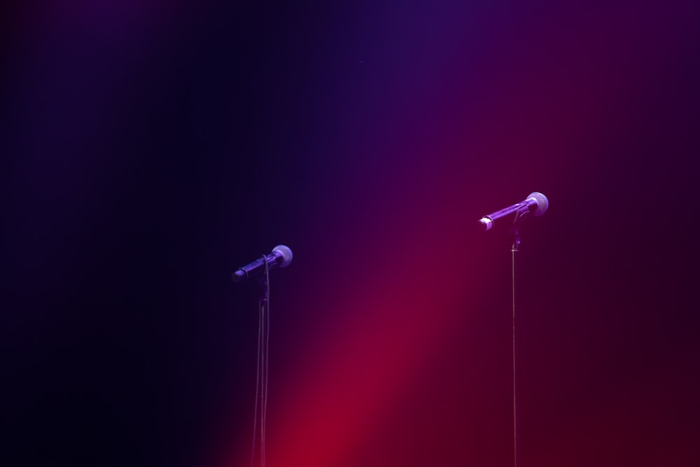 a couple of microphones sitting next to each other on a stage