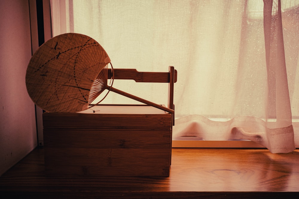 a satellite dish sitting on top of a wooden box