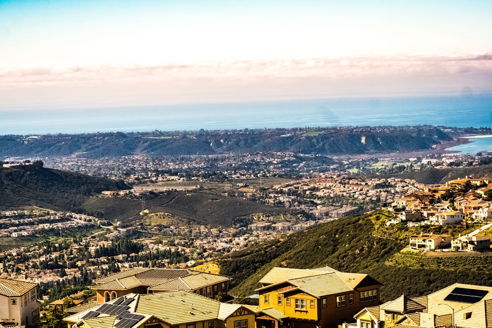 a view of a city with mountains in the background