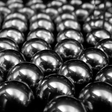 a bunch of shiny balls sitting on top of a table