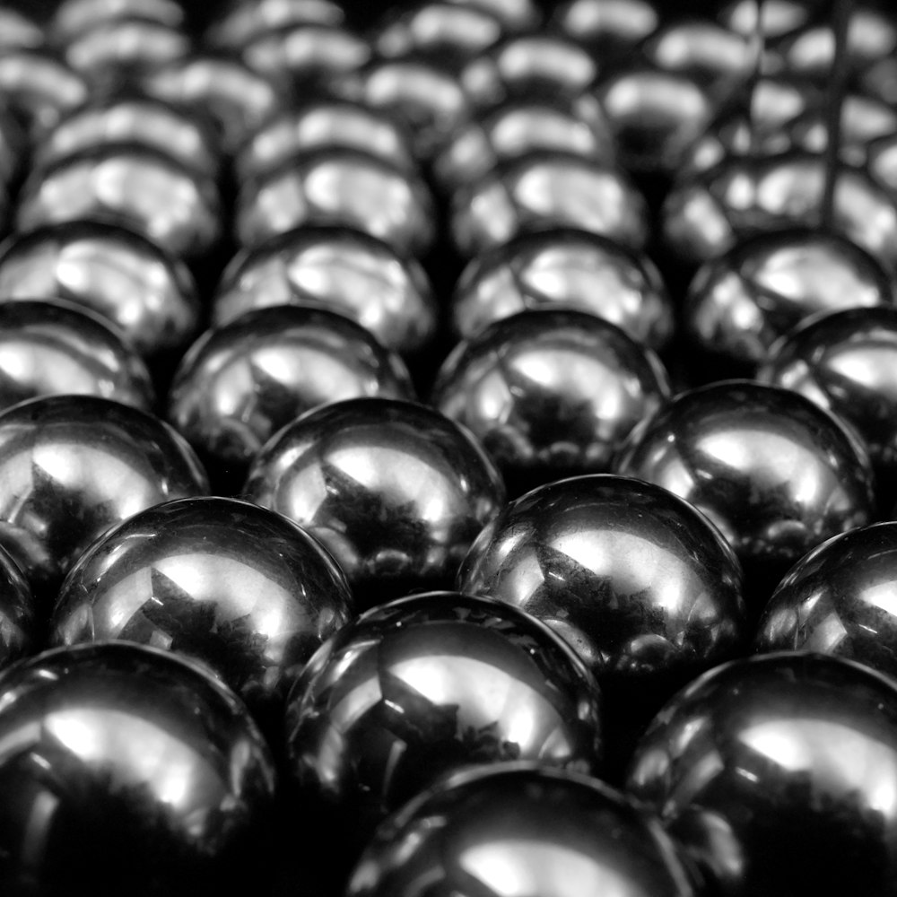 a bunch of shiny balls sitting on top of a table