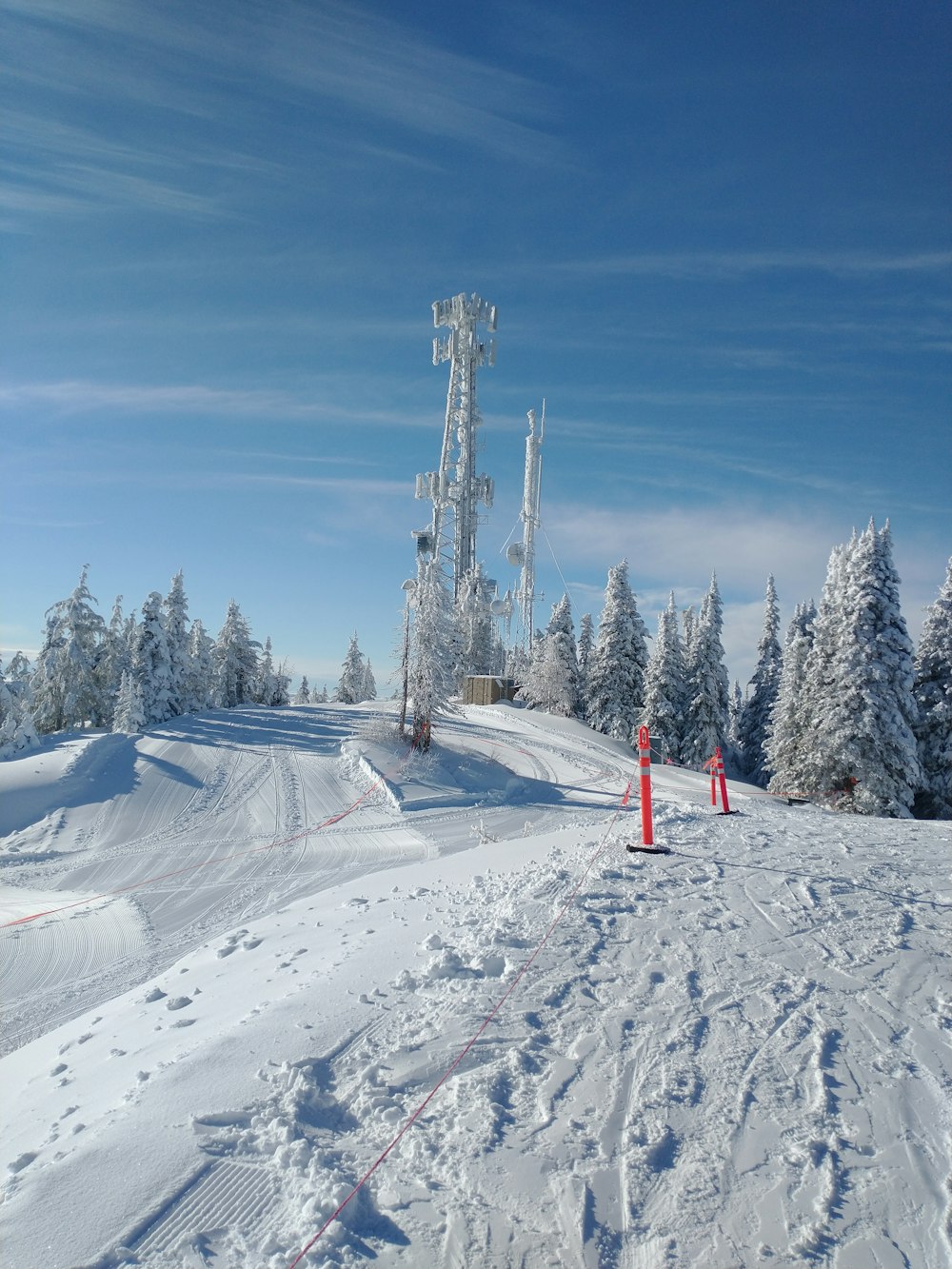 a person riding skis on a snowy surface