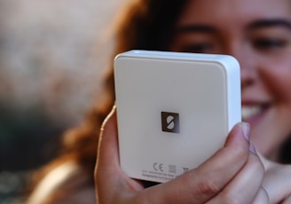 a close up of a person holding a cell phone