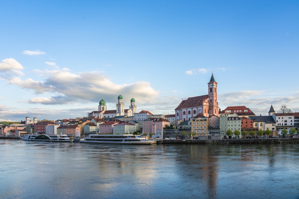 a large body of water with a city in the background