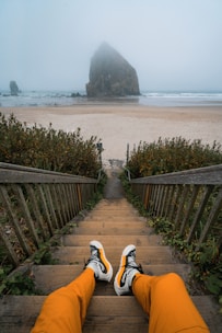 a person with their feet up on a set of stairs