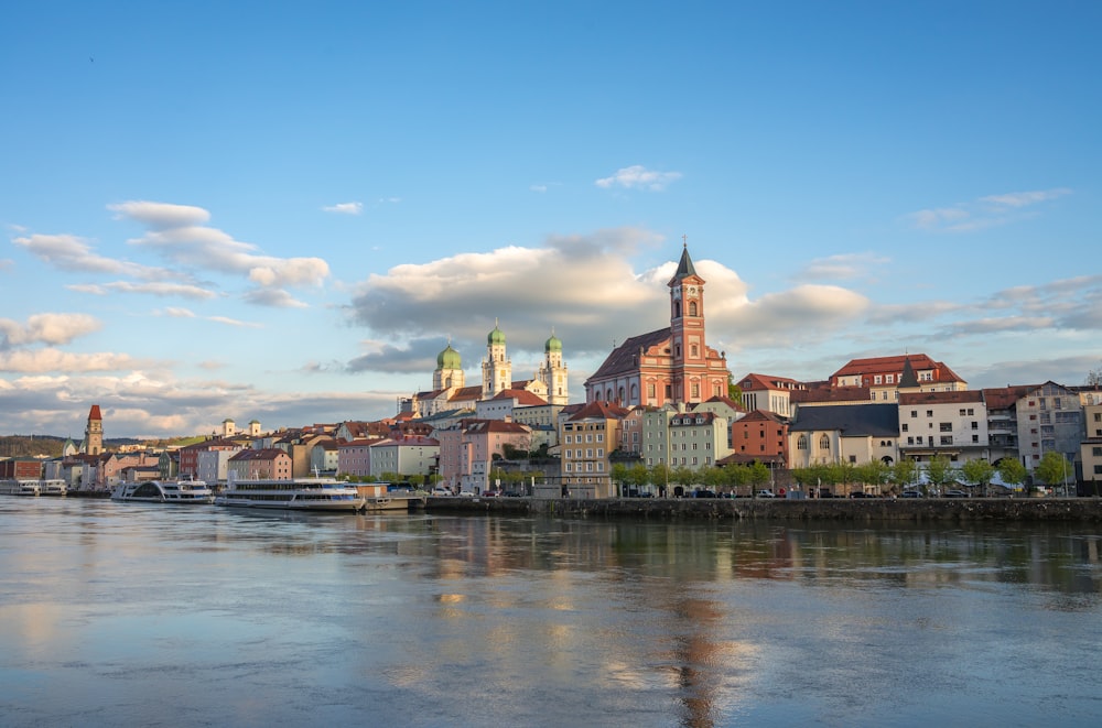 a large body of water with a city in the background