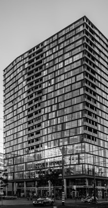 Commercial building with glass facade located on a busy downtown street