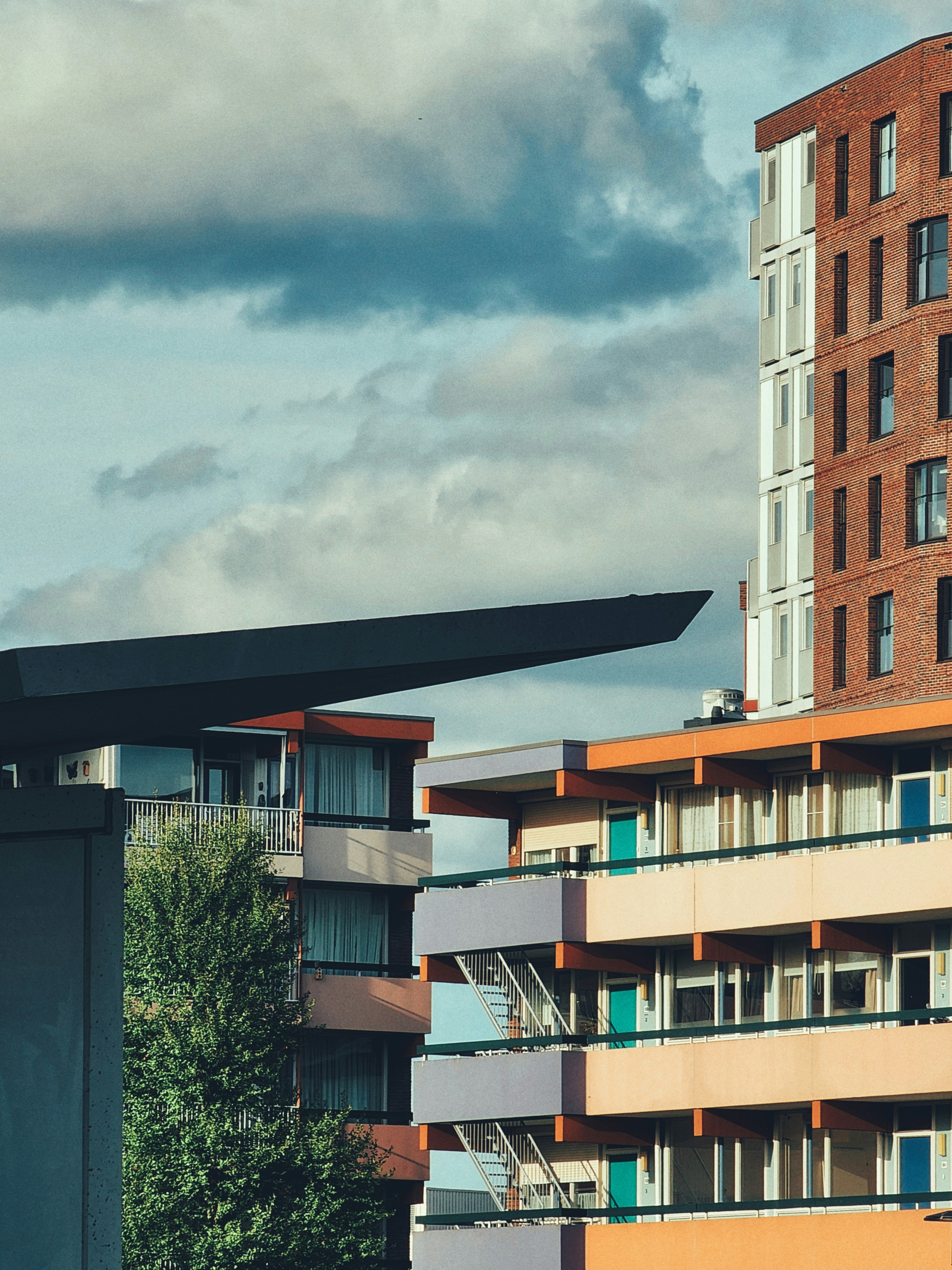 a tall building with balconies on top of it