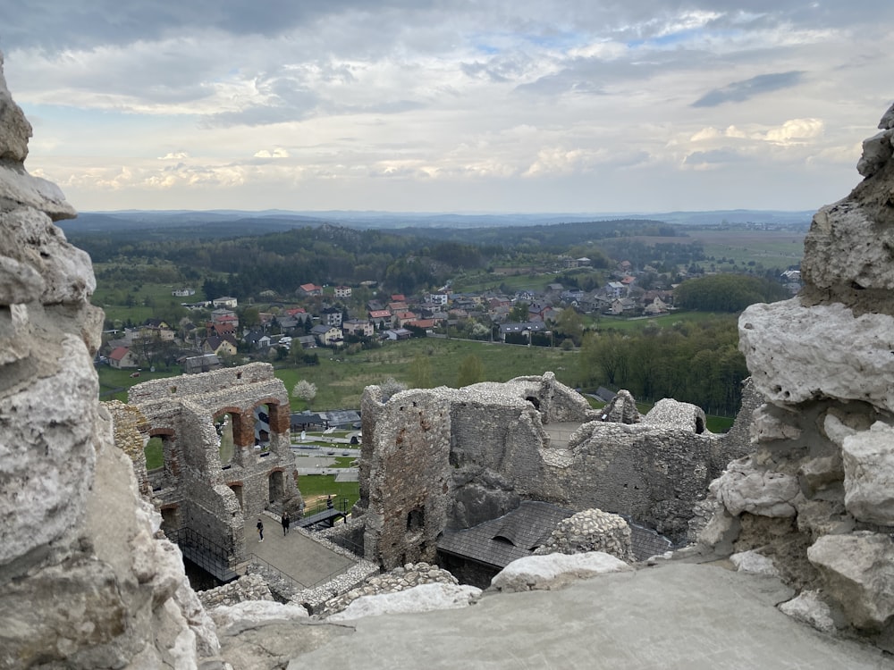 a view of a city from a stone tower