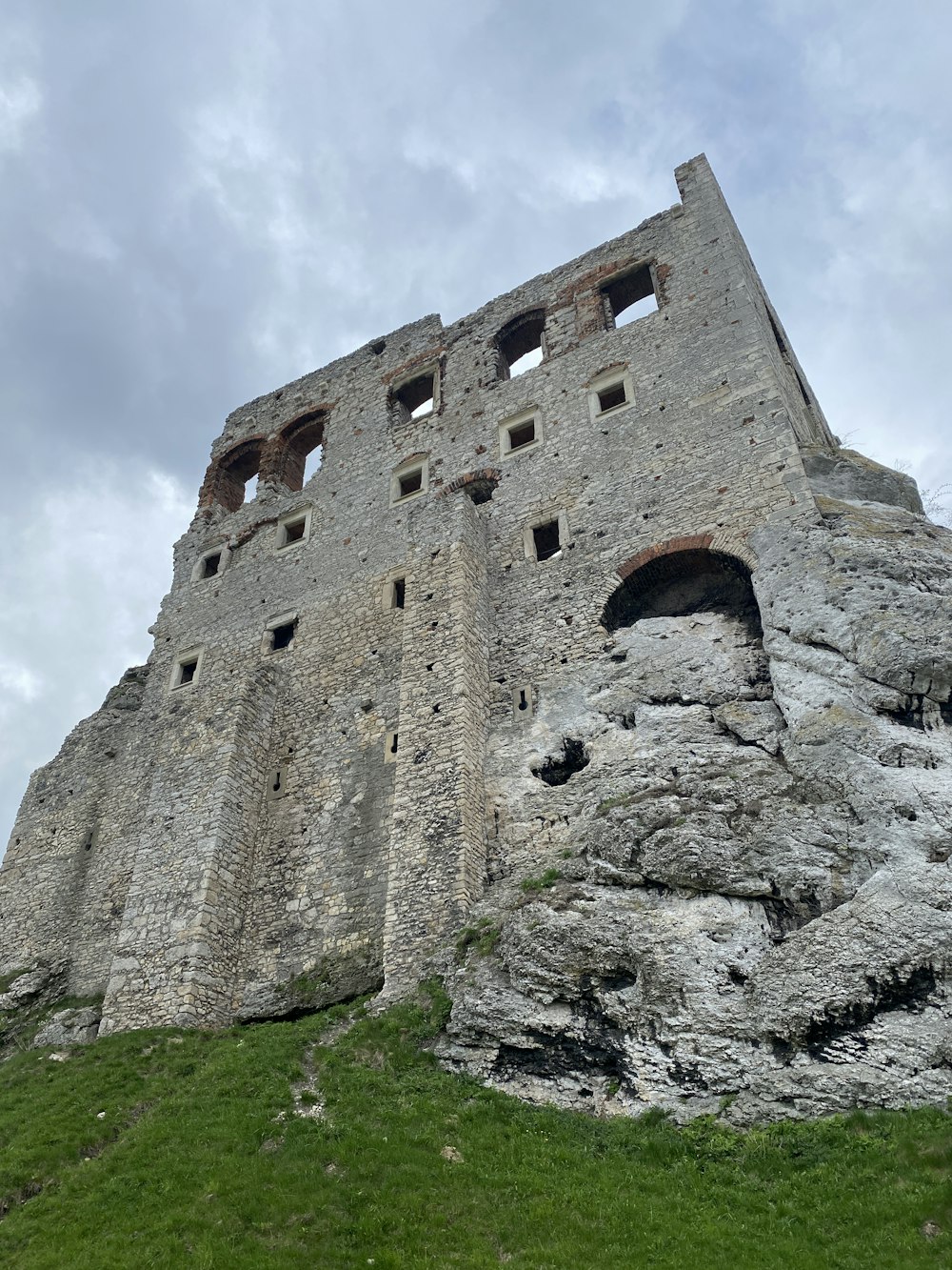 a large stone building with windows on the side of it