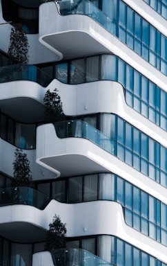 Modern residential building facade with balconies and greenery